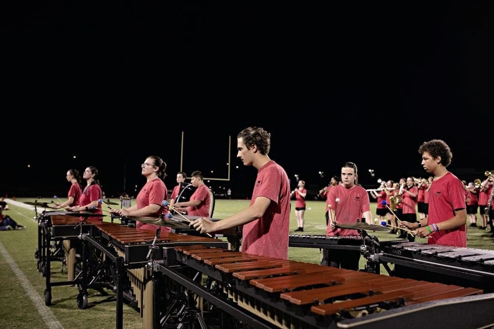 Desert Ridge marching band performing at a home football game