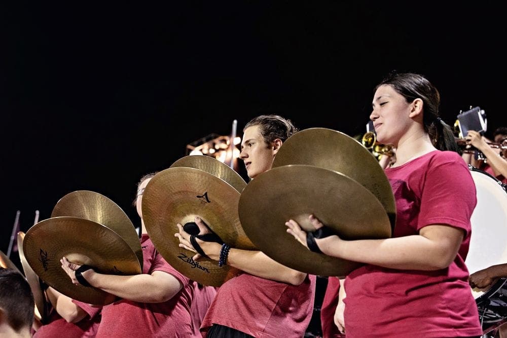 Desert Ridge marching band performing at a home football game